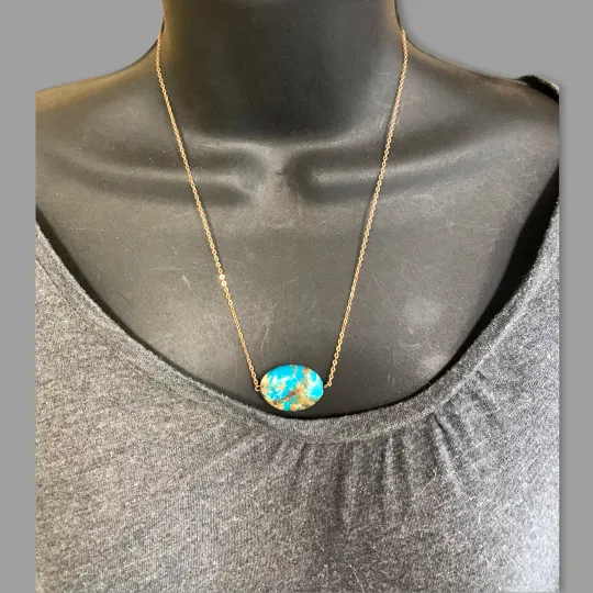 Turquoise pendant on gold chain